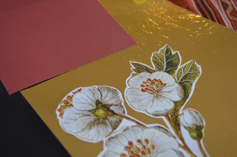 Close-up of floral pattern craft product on bed