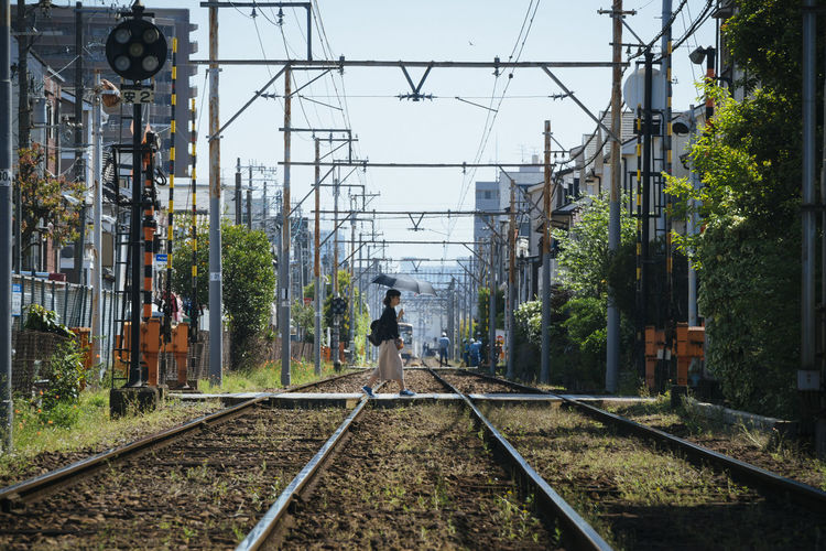 Man walking on railroad track