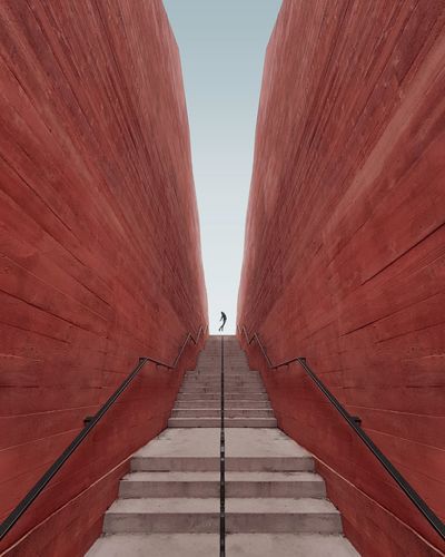 Low angle view of red steps against clear sky