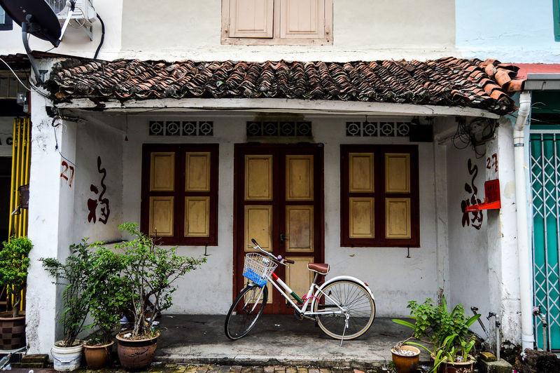 Bicycles on street against building