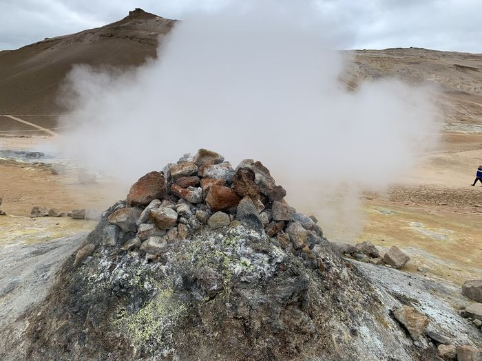 Scenic view of clouds over mountain
