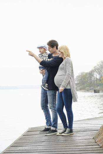 Family with son on jetty