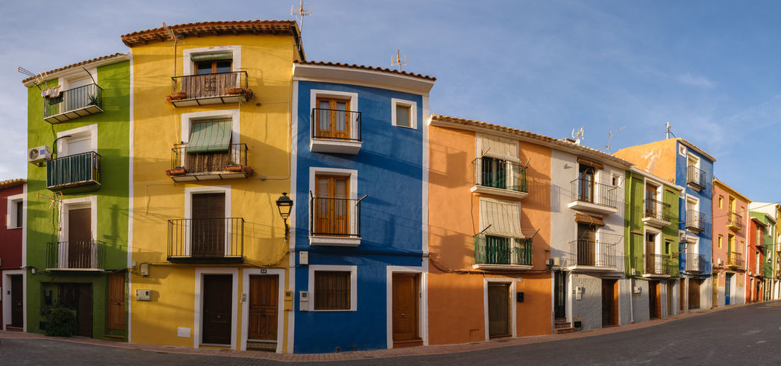 Residential buildings against blue sky