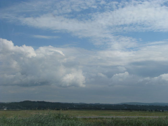 Scenic view of cloudy sky over field
