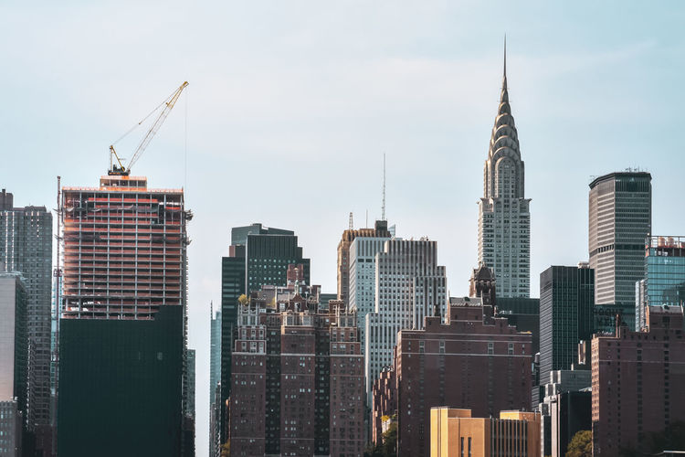 Office buildings and apartments on the skyline at sunset. manhattan, new york city, usa.