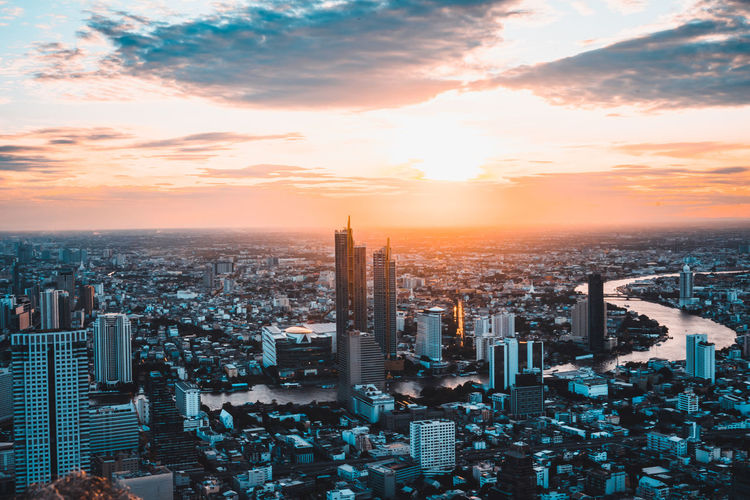 Sunset and twilight view of city. seen from mahanakhon tower famous skyscrapers