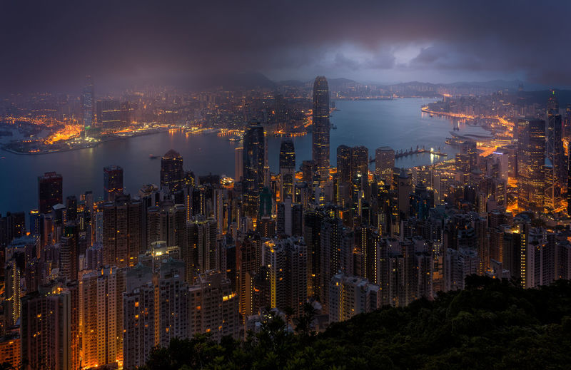 Aerial view of illuminated buildings in city at night