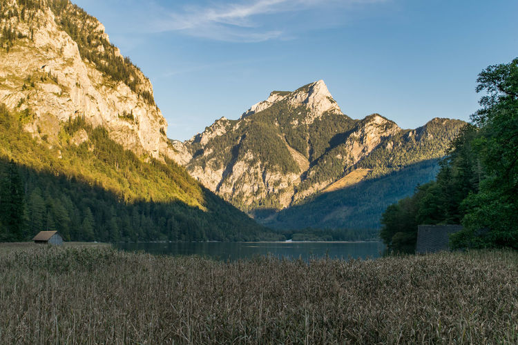 Scenic view of mountains against cloudy sky