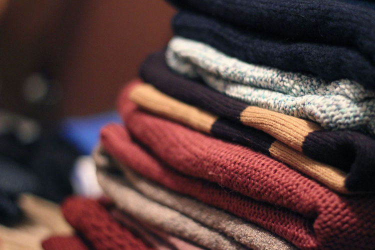 Close-up of folded sweaters