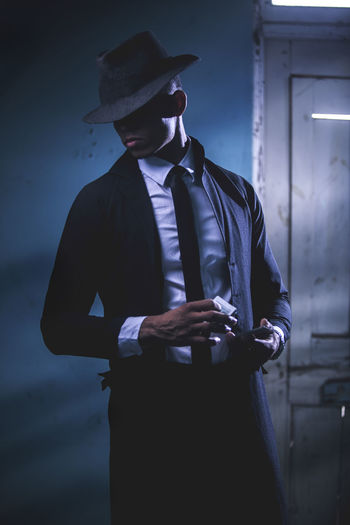 Man wearing hat standing at home