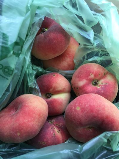 Plum fruit in plastic bag
