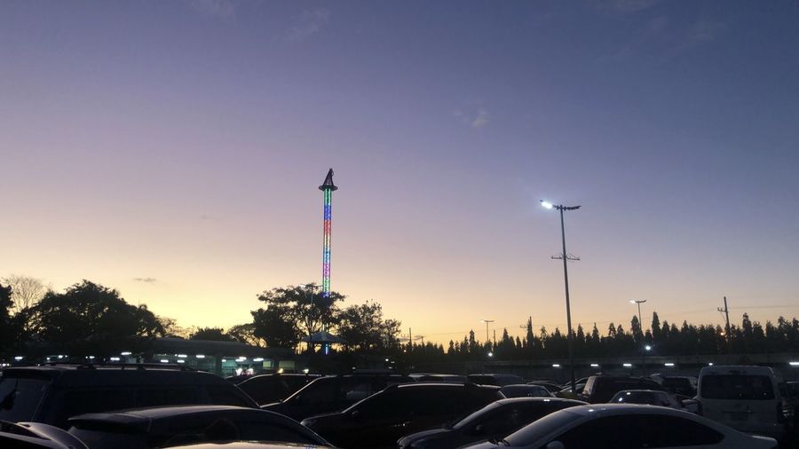 Cars in parking lot at sunset