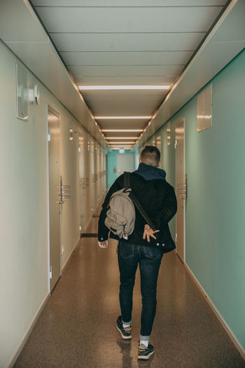 Woman walking through corridor