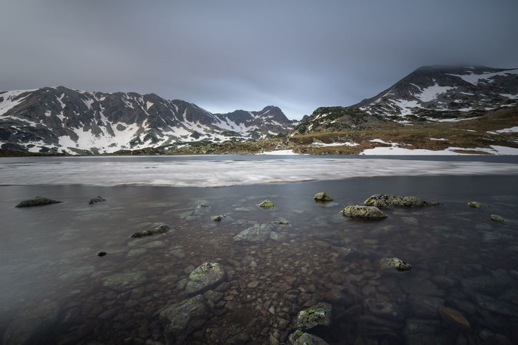 Long exposure in the morning at bucura lake, in retezat mountains 