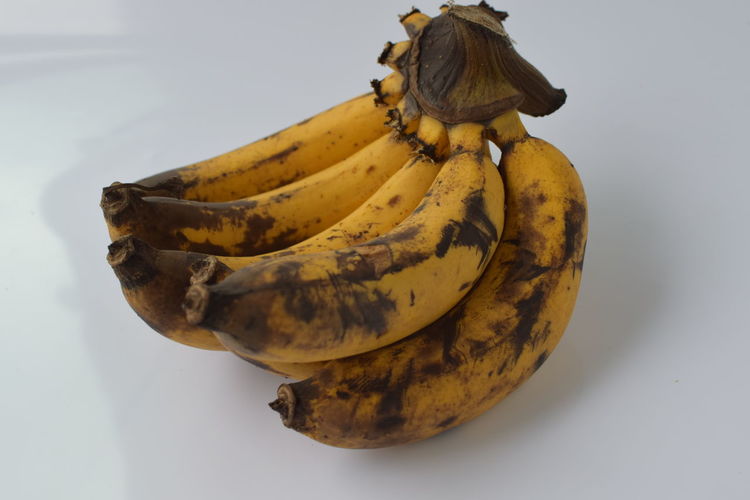 Close-up of bananas on white background