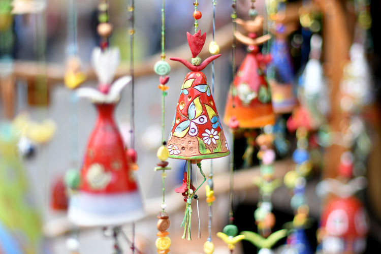 Colorful decorations hanging at market stall