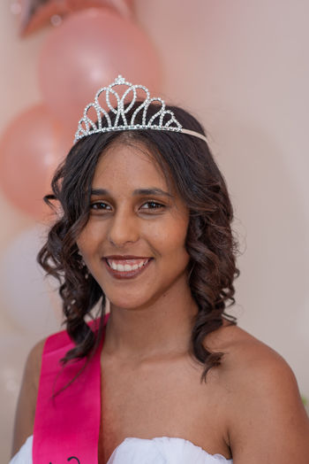 Portrait of smiling young woman wearing tiara