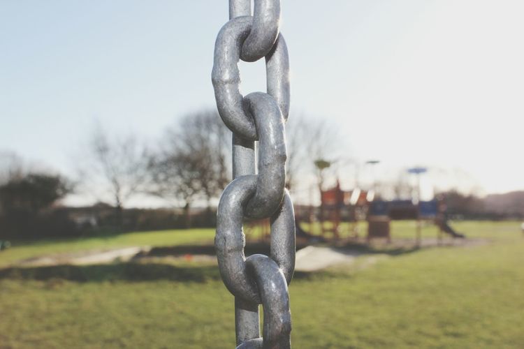 Close-up of chain against clear sky