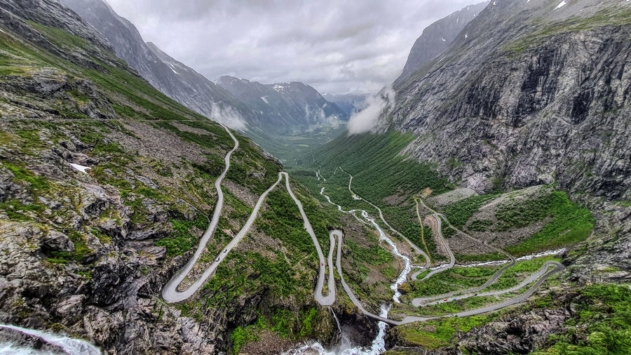 Scenic view of winding road against sky
