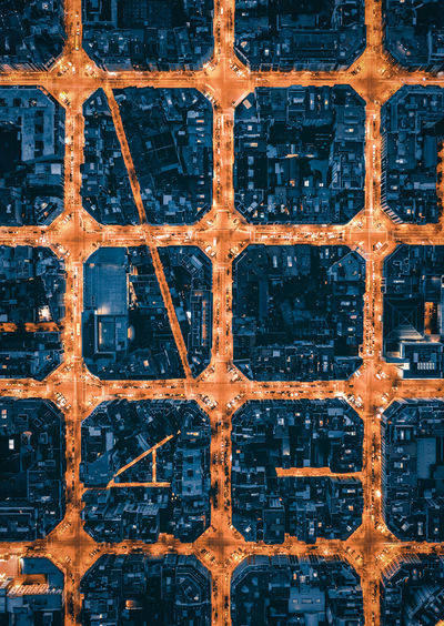 High angle aerial view of city blocks of barcelona at night 
