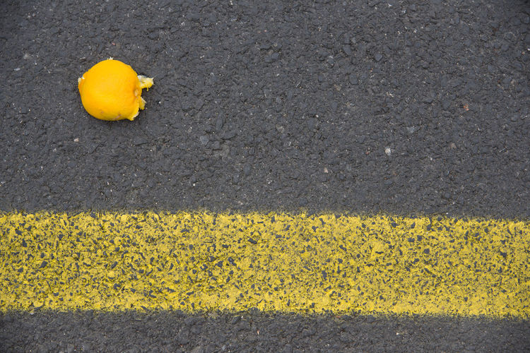 High angle view of orange on road