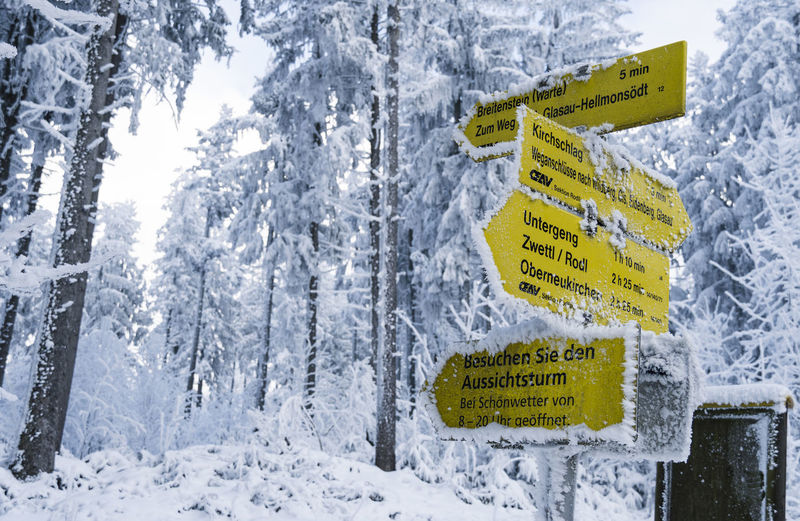 Information sign on snow covered land