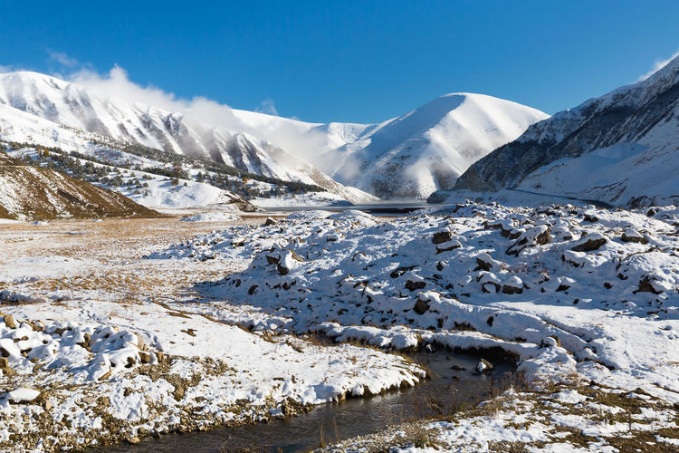 Winter in the mountains of chechnya. scenic view of snowcapped mountains against sky