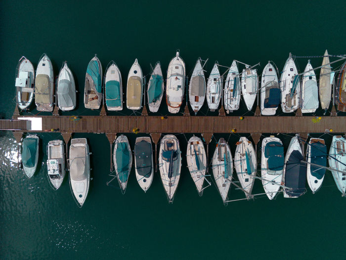 Row of boats moored in lake