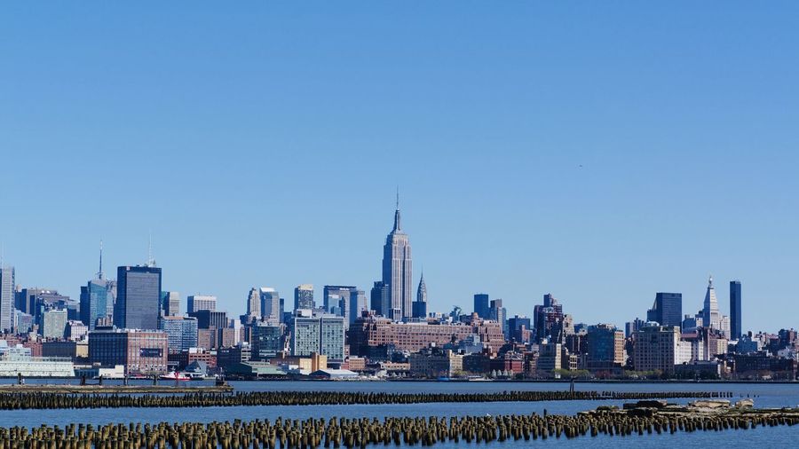 View of the new york city skyline from across the hudson. 