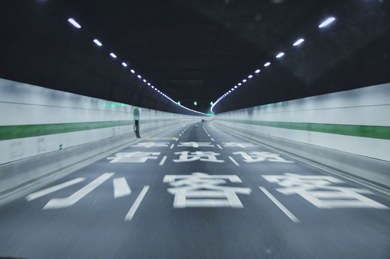 High speed view inside illuminated tunnel near chongming island