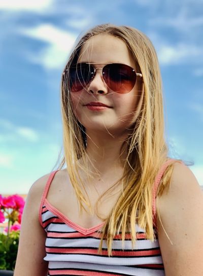 Portrait of girl wearing sunglasses outdoors