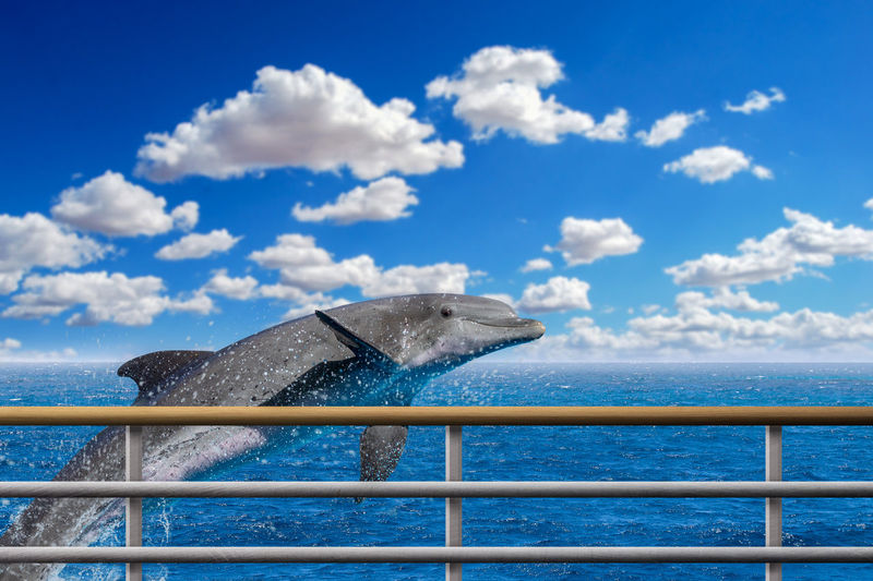 Built structure by sea against blue sky