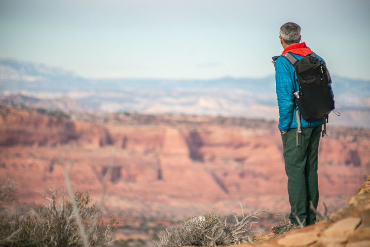 Hiker contemplates grand staircase escalante from paria plateau