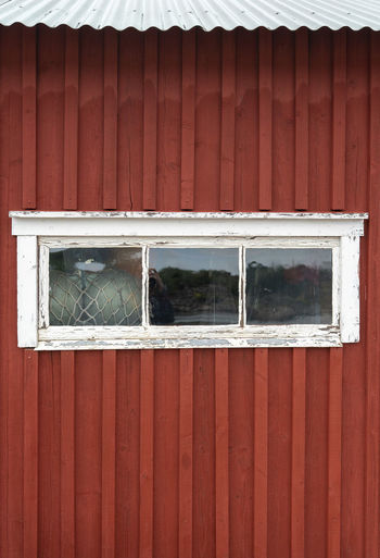 Full frame shot of red old wooden building
