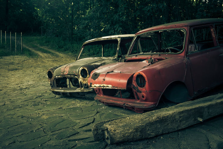 Abandoned cars on footpath