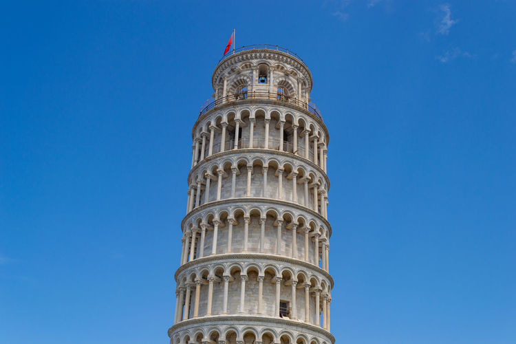 Pisa tower, italy. low angle view of building against clear blue sky