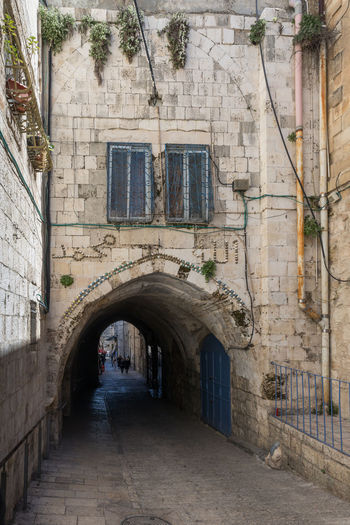 Narrow alley amidst old buildings in town
