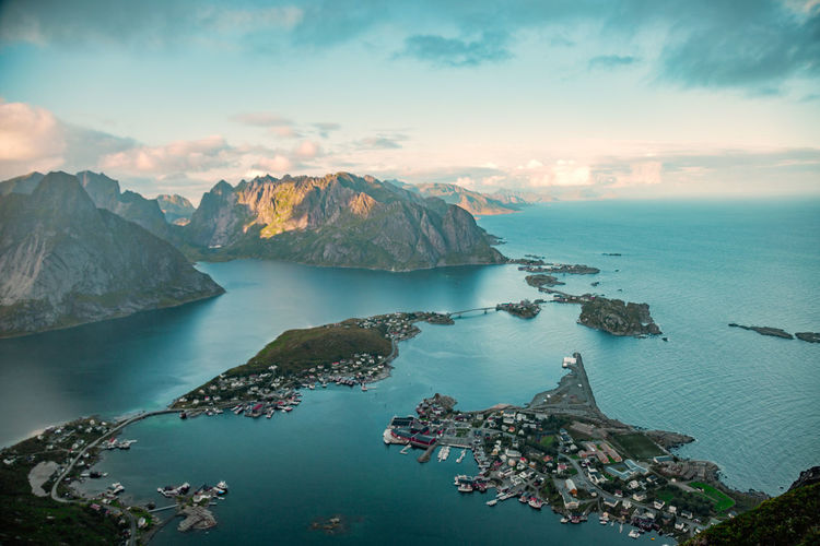 Scenic view of mountains and sea against sky during sunset, lofoten, norway
