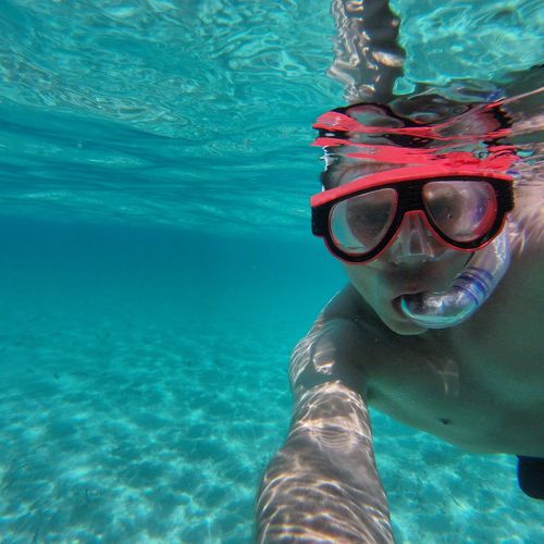 Portrait of mid adult man snorkeling undersea