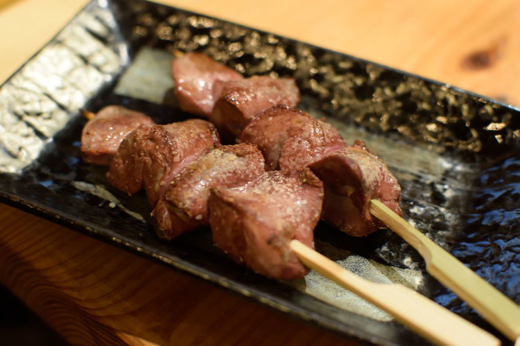 High angle view of meat on barbecue grill