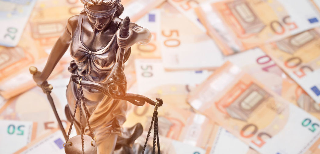Lady justice is on several 50 and 20 euro bills. concept photo for a lawsuit where a lot of money is
