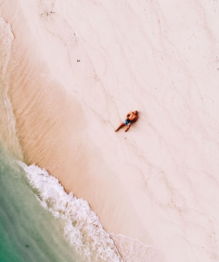 High angle view of man surfing on sand