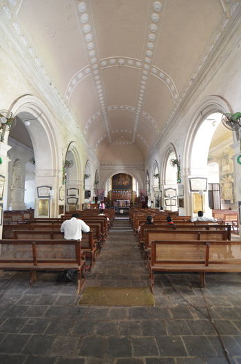Rear view of people sitting in church