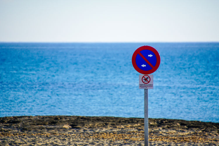Road sign on seashore