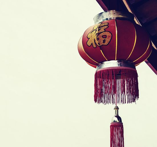 Close-up of lantern hanging against clear sky