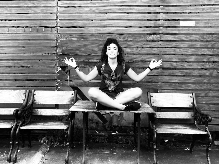 Portrait of woman sitting on chair