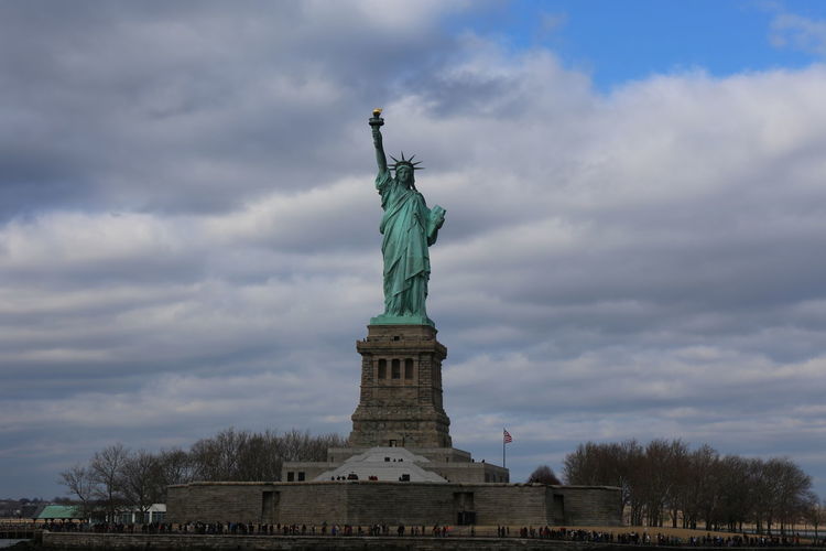 Low angle view of statue against cloudy sky
