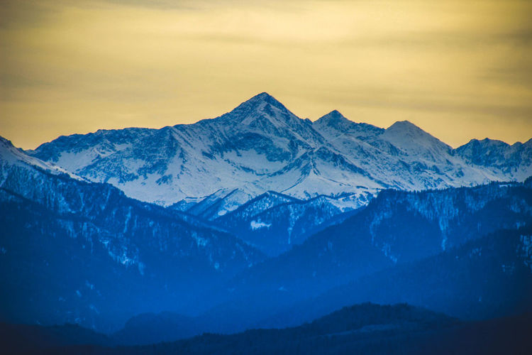 Scenic view of snowcapped mountains against sky