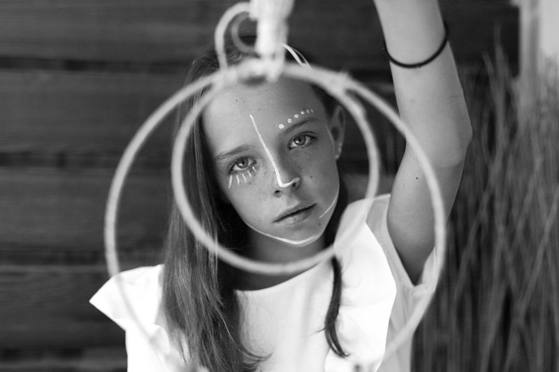 Portrait of smiling girl with face paint standing outdoors
