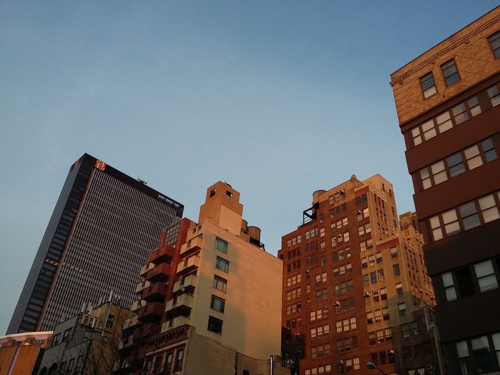 Low angle view of buildings against clear sky